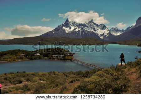 A photographer in national park of Chile Torres del Paine. 
