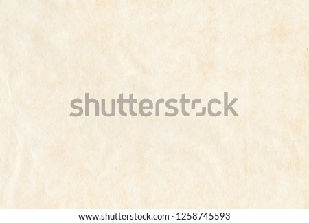 Light vintage old paper parchment texture background Royalty-Free Stock Photo #1258745593