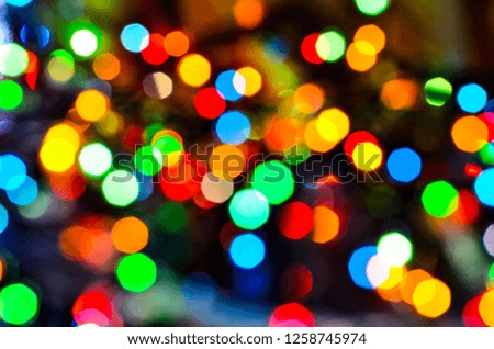 
Close-up of the magical shine of the Christmas lights of the reflections from the garlands. Fairy dream.