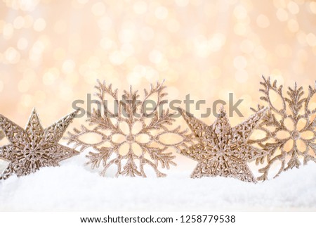 Christmas greeting card. Festive decoration on gold bokeh background. New Year concept. Copy space.  Flat lay. Top view.