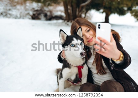 Beautiful girl taken pictures of her self, instagram. Girl blogger and four-legged friend