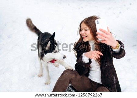 Beautiful girl taken pictures of her self, instagram. Girl blogger and four-legged friend