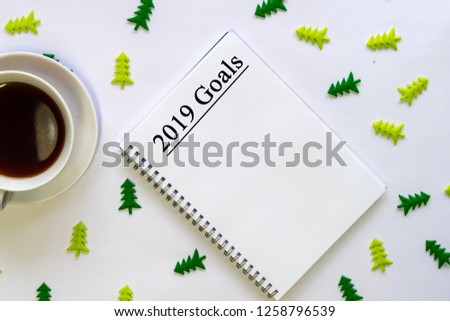 New year 2019 goals ,plans ,action text on notepad with office accessories.Business motivation,inspiration concepts