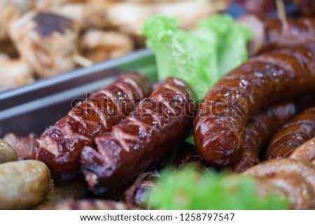 Delicious grilled sausages. Fine Food Fair. Selective focus