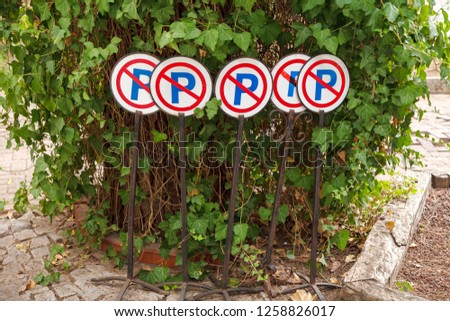 Road signs are prohibited parking stand in a green shrub