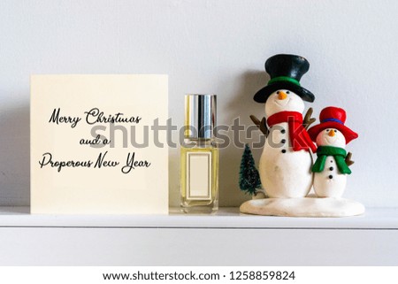 Christmas Card background with festive decoration and text - Merry Christmas and a Prosperous New Year on a Christmas with snowmen and gift 