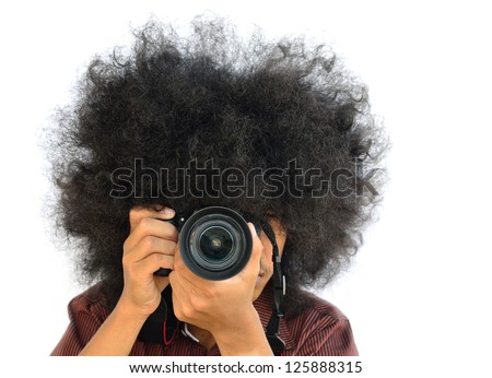 man with long hair and holding digital camera