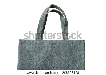 Felt fabric shopping bag against white background. Royalty-Free Stock Photo #1258925128