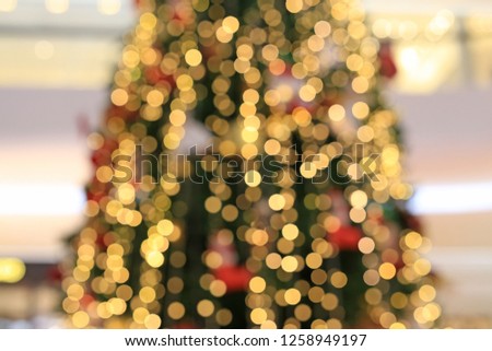 Blurred colorful bokeh lights on Christmas tree background.