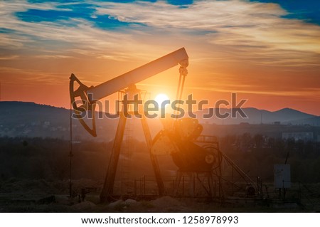 oil pump on orange sunset