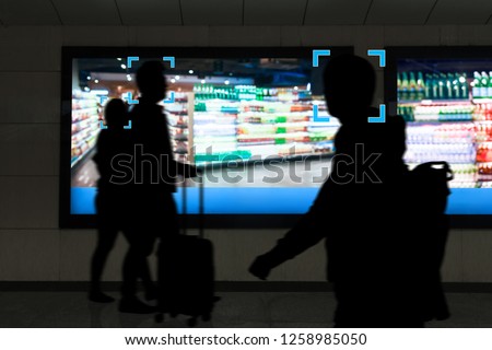 Intelligent Digital Signage , Augmented reality marketing and face recognition concept. Interactive artificial intelligence digital advertisement in retail shopping Mall.