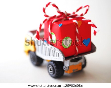 Old metal truck with red gift box