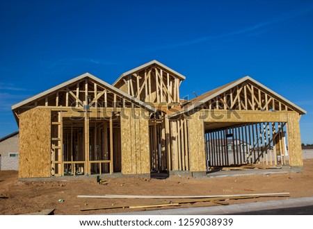 New Home ConstructionIn Framing Stages Royalty-Free Stock Photo #1259038939
