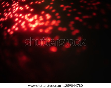 abstract lens flare on background. Red defocused bokeh lights. blur christmas wallpaper decor. festive glowing circles design