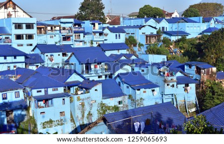 Blue houses in village Kampung Biru Arema, the touristic village of Jodipan Village in Malang City, Java Island, Indonesia