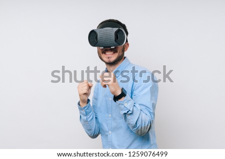Photo of excited man for new round in virtual fighting game