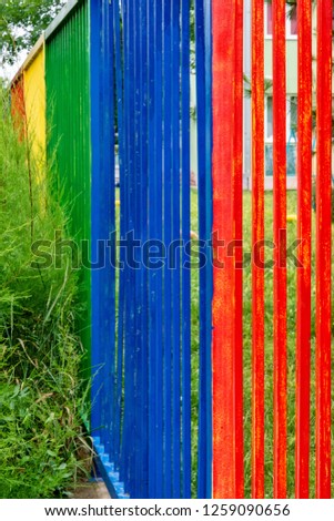 Multicolored fence in a public place