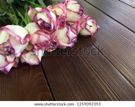 rose bouquet fades on wooden background