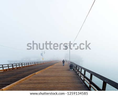 View of the wooden bridge in foggy weather, Santa Barbara, California, USA. Copy space for text                   