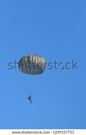 Parachutes with military supplies. - Image