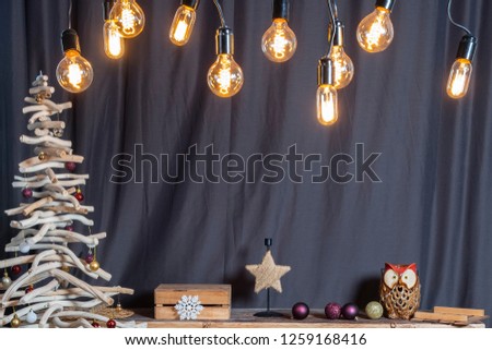 Vintage Christmas room decorations with unusual sprice made of wood and vintage Edisson bulbs.