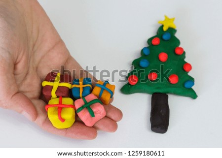 step by step making pine tree and gifts for Christmas with play dough for children's activity. school,nursery or kindergarten lesson plasticine concept.
