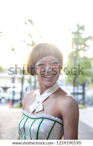 Asian female model poses for pictures at the hair cut