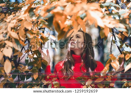 Natural beautiful woman surrounded by leaves, people in nature concept