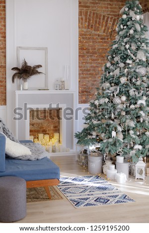 New Year's decor with Christmas tree, fireplace