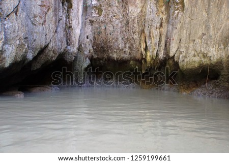 Beautiful Grey Cliff Of Rock And Sea Water, Thailand. Stone mountain texture. Nature Background. 