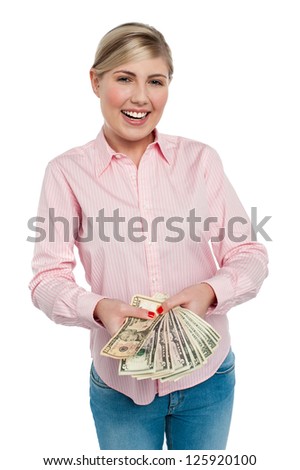 Smiling woman with cash isolated over white background.