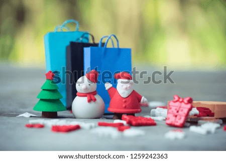 Shopping bags and christmas decoration stuffs. Concept of Black Friday, boxing day, year end sales.