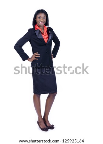 Portrait of a cheerful young African American businesswoman with hand on hips