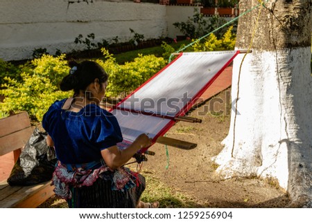 Woman weaving in an old village in Central America.
Traditional waver from Guatemala.