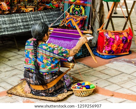 Woman weaving in an old village in Central America.
Traditional waver from Guatemala. Royalty-Free Stock Photo #1259256907