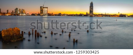 Long Exposure Picture of the East River At Dawn With Lond Island City in the Background