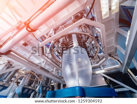 Modern automated production line in factory. Plastic bag manufacturing process. Background Royalty-Free Stock Photo #1259304592