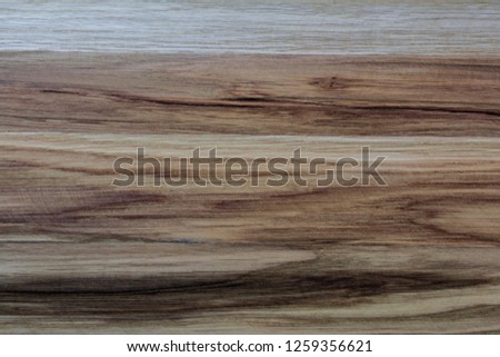 The structure of the wooden surface of oak brown color closeup.