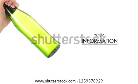 Glass bottle of soda water in hand pattern on a white background isolation