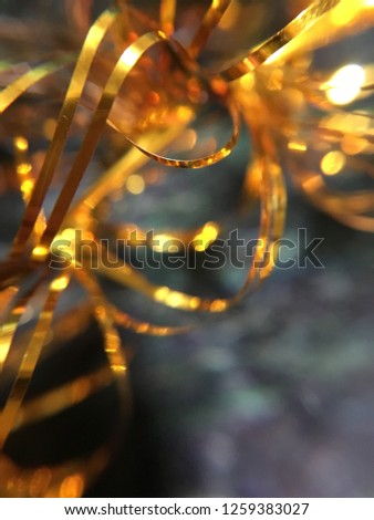 Abstract macro Christmas garland background. Backdrop golden sparkles. New year decoration, Joyful happy vibes. Holidays atmosphere. Nobody