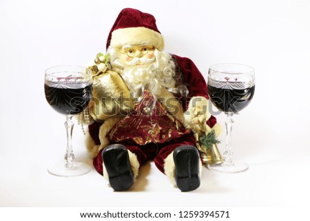 Santa Claus with a glass of red wine on a white background