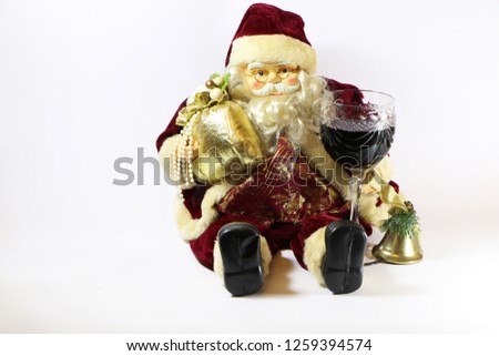 Santa Claus with a glass of red wine on a white background