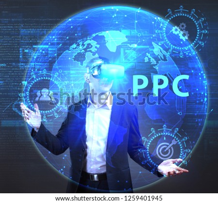 The concept of business, technology, the Internet and the network. A young entrepreneur working on a virtual screen of the future and sees the inscription: PPC