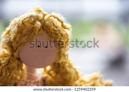 Cute girl doll made from fabric and the hair made from manila rope.