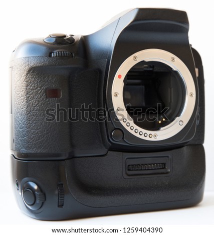 Professional Digital SLR camera with lens and vertical battery grip isolated