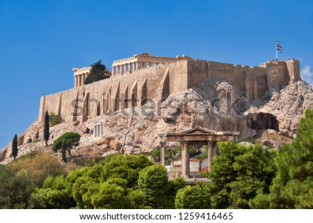 Acropolis hill with ancient temples in Athens, Greece, on a bright day