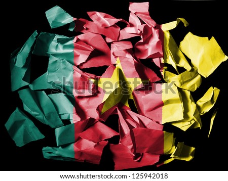Cameroon. Cameroonian flag  painted on pieces of torn paper on black background