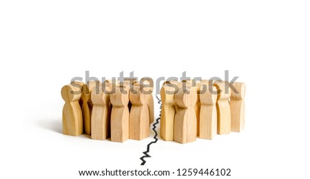 Two groups of people are separated by a crack. The concept of contention and quarrel, misunderstanding and enmity. Symbol of civil war and separatism. Try on and negotiate the world. Royalty-Free Stock Photo #1259446102