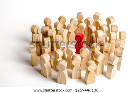 A crowd of people surrounded the red man. Accusation of crime, mob law over a person, lynch court. The leader in the center, the leader, an example for diving. Angry crowd Royalty-Free Stock Photo #1259446138