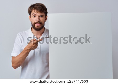 A man in a shirt shows on the mockup of Poster                   